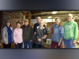 Feed Fannin volunteers, from left, Kathy Beck, Priscilla Cashman, Ron Ciochon, Glenn and Lynda Chambers, and Robin and Larry Fry helped fill boxes to be distributed for Meals on Wheels Friday, October 29.