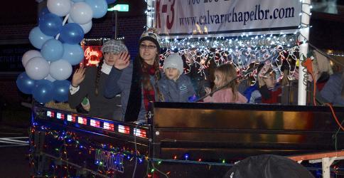 Folks from Calvary Chapel Christian School wave to the crowd along Mountain Street in Blue Ridge as they make their way along the Light Up Blue Ridge parade route Saturday, November 27.