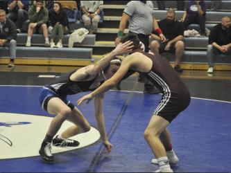 Blake Summers, left, works his opponent in recent action for the Fannin County Rebels wrestling team.