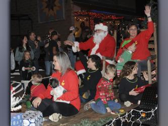 Santa and a few of his helpers arrived to the delight of children gathered in Ducktown for the annual parade Saturday night.