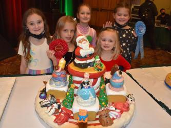 The Glitter Girls won second place in the Child Division (ages 5 to 7) at the National Gingerbread Competition, in Asheville, North Carolina, November 22. Shown with their creation are, from left, Violet Lakes, Sarah Miller, Maggie Schneider, Bryna Thompson and Caroline Montieth. 