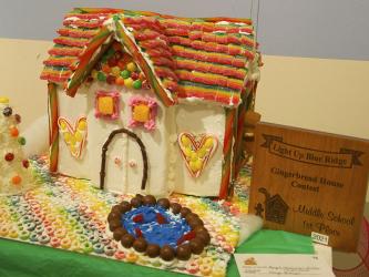 “Paige’s Whimsical Winter Wonderland” by Fannin County Middle School student Paige Billups took first place in the middle school category of Light Up Blue Ridge’s Gingerbread House contest. A full village of gingerbread creations are on display now through December 12 at The Art Center, 420 West Main Street, Blue Ridge.