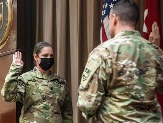 Abby Lanni re-affirms the Oath of Commissioned Officers with Colonel Richard Ball, Maneuver Support Center of Excellence Chief of Staff, during her lieutenant colonel promotion ceremony at Fort Leonard Wood, Missouri, November 23.