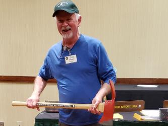 Gilbert Treadwell holds up his 2021 Benton MacKaye Trail Association Trail Worker of the Year axe that was presented to him at the association’s Annual Meeting Awards Ceremony Monday, November 13.
