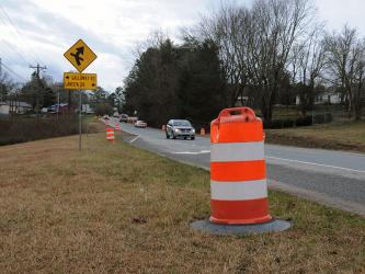 Large orange barrels line Highway 5 south of McCaysville as contractors being preparations for widening the highway.