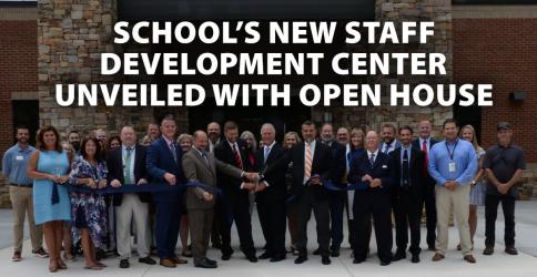 Fannin County School System (FCSS) officials and school board members gathered with contractors Thursday, July 21, to officially cut the ribbon dedicating the new FCSS Staff Development Center. 