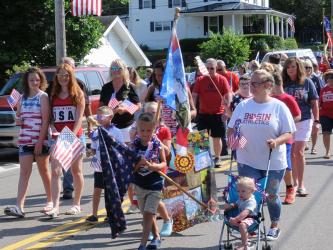 All ages took part in the annual Walking Parade down Main Street in Ducktown. David Beckler organized the first such event, and he was remembered by many of those on hand this year.