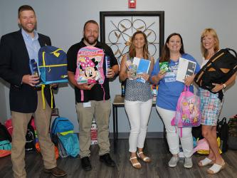 Fannin County School System leaders have been busy collecting items and preparing for Saturday’s Summer Bash. Shown with some of the supplies to be given from to students are, from left, Dr. Michael Gwatney, Dr. Scott Ramsey, Sheena Rymer, Tara Cantrell and Shannon Miller. 