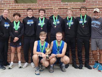 The FCHS Men’s cross country team smiles after a fourth place finish in the State Meet. Shown are, from left Coach Pass, Zechariah Prater, Phoenix Leifer, Conner Kyle, Gaven Davis, Luke Callihan, Benjamin Bloch, Coach Cosentino and kneeling seniors James Kyle and Sam Jabaley. 