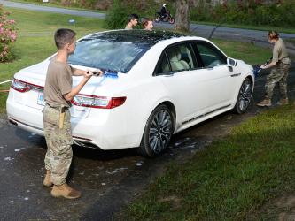 Cadets from Mountain Area Christian Academy’s Christian Junior Reserve Officers Training Corps program worked earlier this year washing cars to raise money for a trip to Utah this summer. The cadets need to raise $15,000 to make the trip focusing on military education. Shown are, from left, Lev Brovko, Genia Lebaen, Jacob Corley and Hannah Corley.
