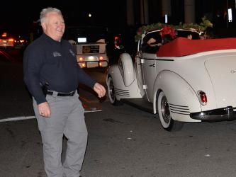 Retiring Blue Ridge Police Chief Johnny Scearce was greeting many of the people who participated in the Light Up Blue Ridge Christmas Parade Saturday night after leading the event through the downtown streets.
