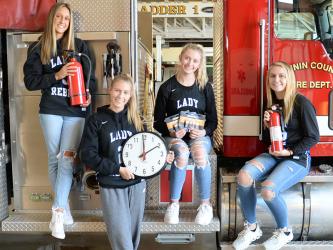 Checking smoke alarms is important when clocks are turned back this weekend, so important that these seniors from the Fannin County Lady Rebels basketball team took time out from practice to remind everyone. Reigan O’Neal, Ellie Cook, Ava Queen and Riley Reeves, from left, encourage everyone to practice fire safety.