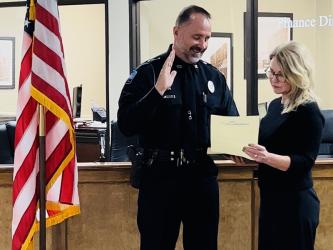 New Chief of Police Robbie Stuart is shown as he is sworn in to the chief position by Blue Ridge Mayor Rhonda Haight.