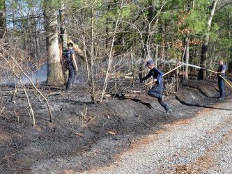 Fannin County firefighters quickly extinguished this brush fire off Henson Way in the Sugar Creek area Thursday afternoon. Among the firefighters responding to the call were, from left, Channing Johnstone, Trent Lowery, and Clinton Hughes.