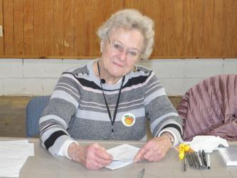 Anne Bailey is pictured at the Colwell voting precinct. She has volunteered at poll stations since the late 1980s.