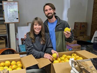 Barbara Davenport and Zac Meaders are two of the volunteer leaders who help Snack in a Backpack prepare food for children every week.