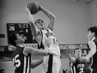 Jordan Farmer goes up for a basket against Pickens County during his high school basketball career. 