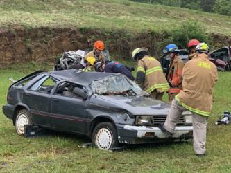 First responders work during an Auto Extrication Advanced Patient Handling Class at the Blue Ridge Kiwanis Club Fairgrounds.