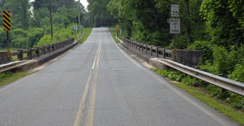 The Madola Road bridge over Fightingtown Creek is clearly marked with a weight limit of five tons. However, this is part of the route outlined for trucks carrying biosolids. Their weight was found to be as high as 73,000 pounds by law enforcement officers. The route is outlined in the pilot program plans filed with the Tennessee Department of Conservation and Environment.