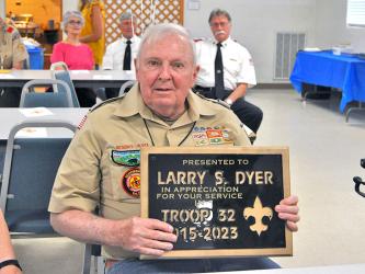 Larry Dyer displays the appreciation plaque given to him by Boy Scout Troop 32 of Epworth upon his retirement. Dyer was celebrated and honored for his many years of service at the Epworth Community Center among friends of Troop 32 and family. 
