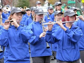 Members of the Fannin County High School Marching Band joined with others in the community to honor veterans Saturday by marching in the annual Veterans Day Parade. Valerie Cash, Lily Bice and Neveah Hill, from left, are shown as the band made its way down East Main Street in Blue Ridge. The band also performed at the Veterans Day ceremony.    