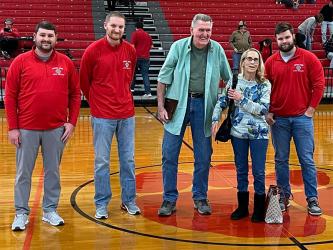 Larry Cantrell was honored by the Copper Basin Alumni Association as a Legend of the Game when the Cougars hosted Lookout Valley. Shown during a plaque presentation are, from left, Matt Ray, Brett Curtis, Cantrell, Connie Cantrell and Dylan Boggs.