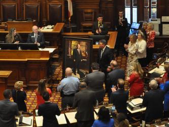 The House of Representatives Chamber in the state Capitol was filled last Thursday morning when a portrait honoring the late Speaker of the House and 7th District Representative David Ralston was unveiled. The portrait now hangs at the entrance to the Chamber to honor Ralston who served for 13 years as the 73rd Speaker of the House.