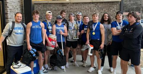 The FCHS Weightlifting team smiles  with their Runner-Up trophy after the state competition Saturday, March 2. Shown are, from left, Coach Wade Woodall, Lawson Sullivan, Cooper Born, Barron Davenport, Isaac Watkins, Braden Taylor, Case Holloway, Jacob Green, Carson Callihan, Jacob Dye, Bryson Cole and CJ. Reece.