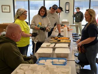 Members of American Legion Post 248 in Blue Ridge were on hand to help with the Ridge the Ridge fundraiser for Shop With a Cop. Charlie Yannis, from left, Liz Walters, Liz Copenhaver (non-member),  and Scott Copenhaver get ready to serve food.